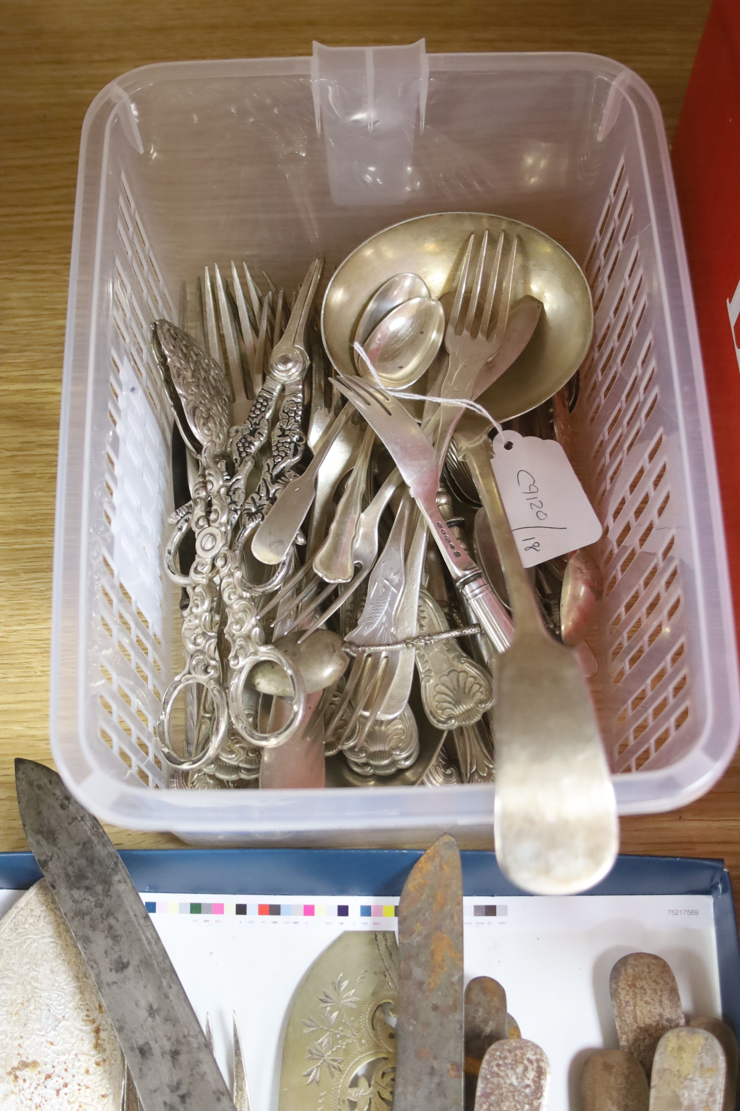 A collection of plated flatware